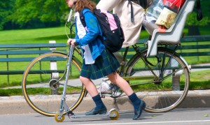 girl pushing bicycle
